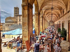 Antiques fair in the Loggia of the Piazza Grande in Arezzo, Italy